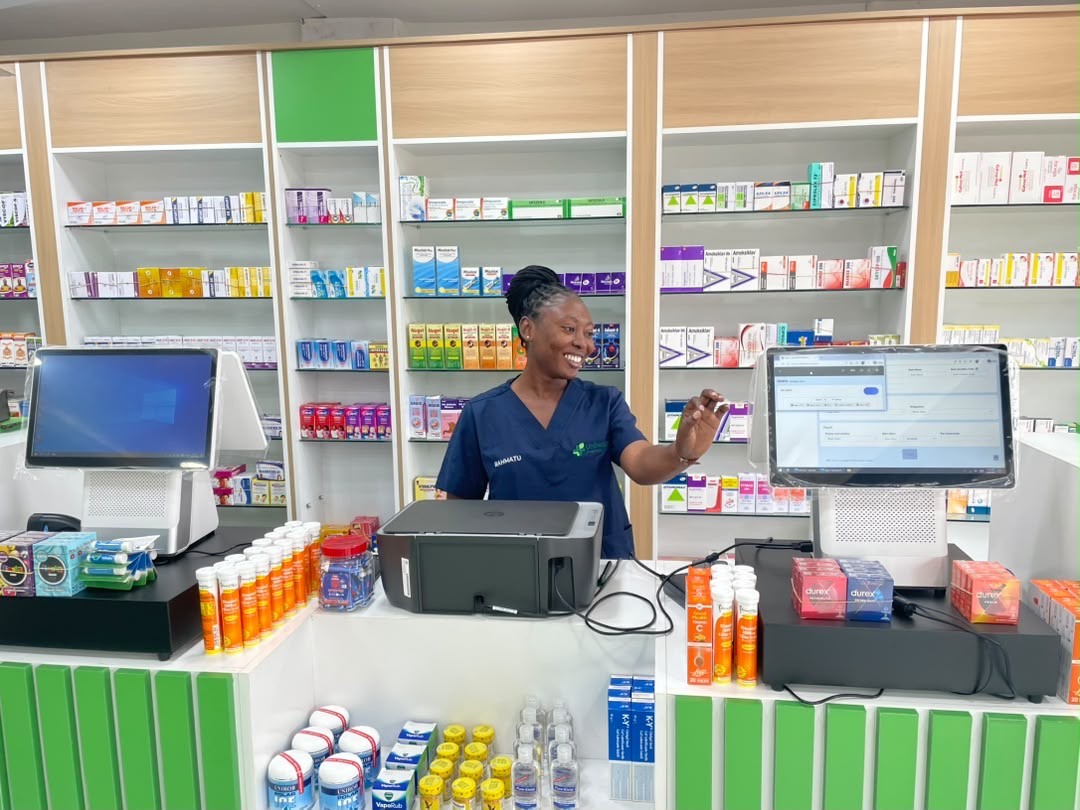 A Unihealth team member at the pharmacy service counter.
